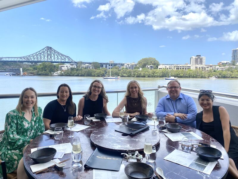 Between Counsel Betweeners enjoying a riverside lunch together in Brisbane